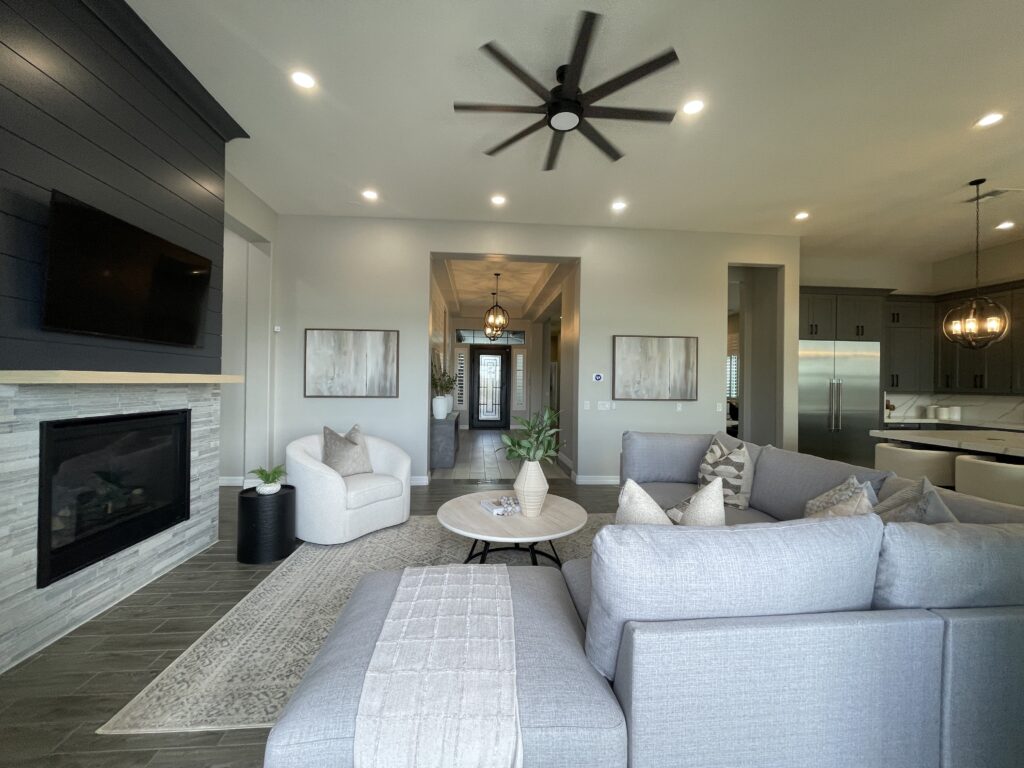 Staged family room in Gilbert, AZ by StyleHouse Home Staging, featuring cozy seating, natural textures, and buyer-ready design.