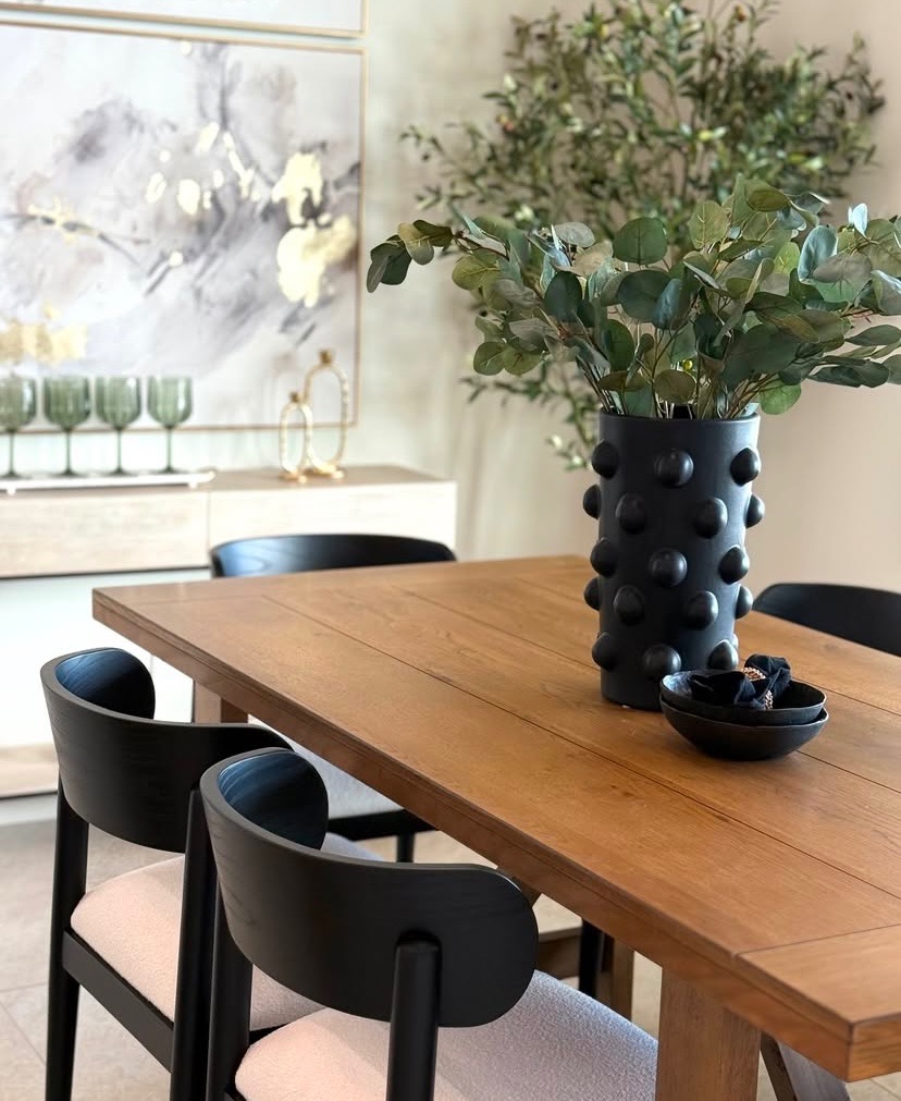 Modern dining professionally staged with green tones