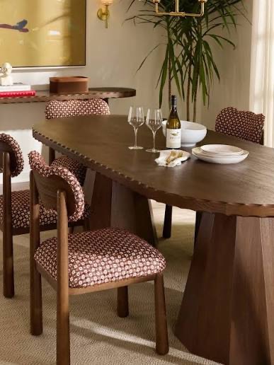 Discover six interior design trends StyleHouse spotted at Las Vegas Market, including burl wood, moody colors, stone tables, and cottage details.